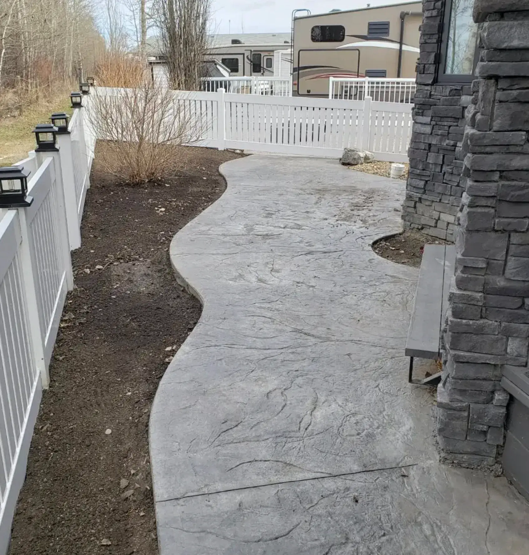 Stamped Concrete & Grass - Before renovation by Epic Landscape Services in Red Deer