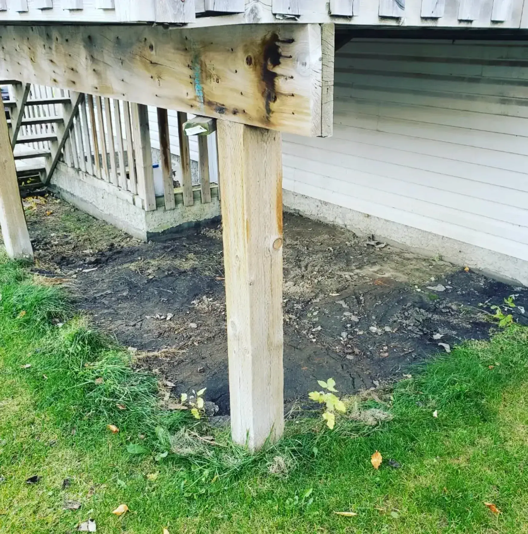 Under-Deck Ground Cover - Before renovation by Epic Landscape Services in Red Deer